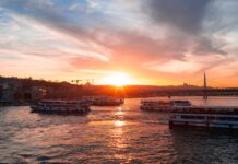 Private Tours and Bosphorus Cruises in Istanbul: What’s Worth the Splurge Boats on the Bosphorus at sunset in Istanbul, with the city skyline in the background