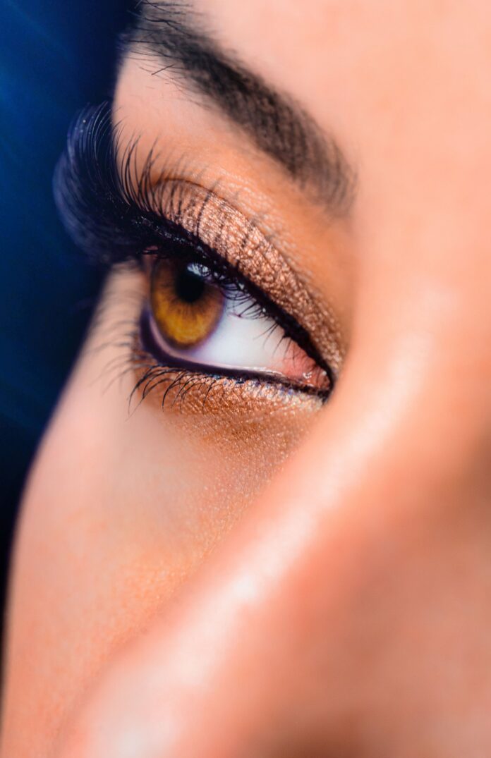 Close-up of a woman's eye with subtle makeup, illustrating cosmetic eye surgery