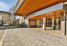 Why Istanbul Is the World Capital of Medical Tourism Modern hospital building entrance with a brick and glass facade, representing Istanbul's medical tourism facilities