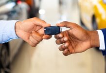 Renting a Car in Istanbul: Is It Worth It? Costs, Tips, and Alternatives Customer receiving car keys from a rental agent in a dealership