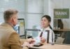 How to Open a Bank Account in Istanbul as a Foreigner Bank teller assisting a customer at a bank counter to open an account