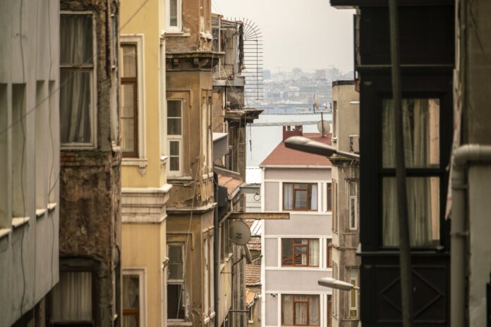 where-not-to-stay-istanbul-backstreet Narrow Istanbul side street with a glimpse of the sea in the distance