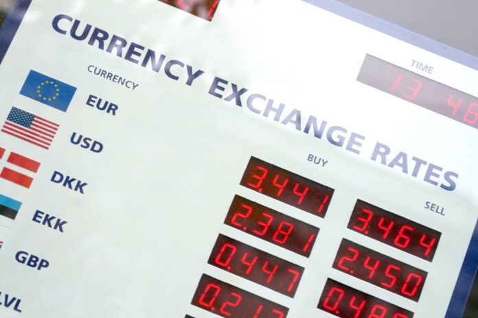 Currency exchange office display board with rates