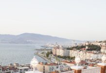 10 Best Rooftop Restaurants in Istanbul With Views Worth the Price Restaurant table set up with a view of the sea, evoking an Istanbul rooftop dinner