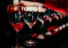 8 Best Wine Bars in Istanbul: Turkish Wines Worth Trying Wine glasses being poured at a stylish wine bar