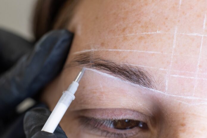 Detailed view of an eyebrow procedure at a cosmetic clinic