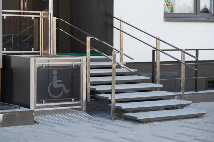 Wheelchair access ramp and stairway at a building entrance
