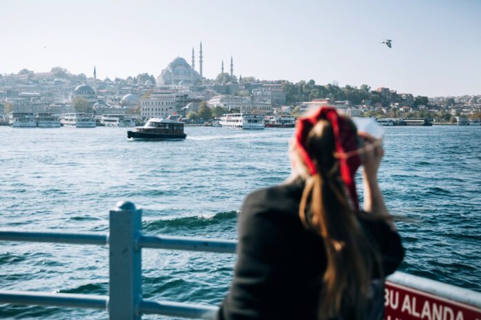 year-in-istanbul-changed-my-mind Young woman looking out over the Bosphorus in Istanbul