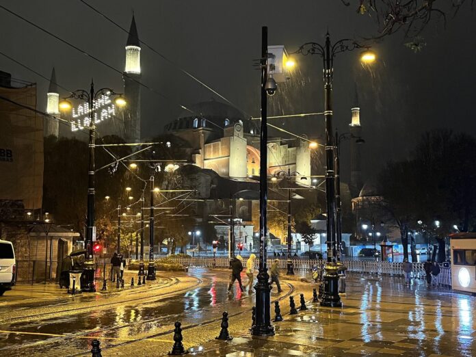 Rainy day scene in Istanbul with a wet cobblestone street